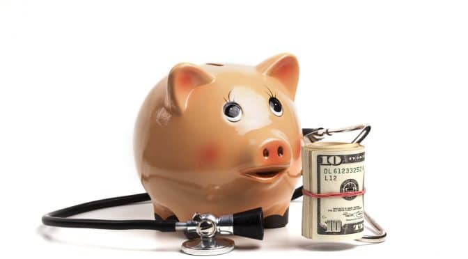 File photo dated 06/01/15 of money in a piggy bank. Subscriptions to Netflix  and increased personal grooming budgets have been included in an updated  assessment of how much money people may need